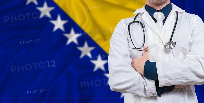 Male doctor with stethoscope on Bosnia flag. Doctor holding stethoscope on Bosnia flag