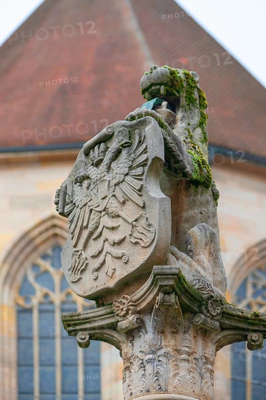 Fountain column with lion and coat of arms with double-headed eagle, 16th century, Dinkelsbühl, Bavaria, Germany