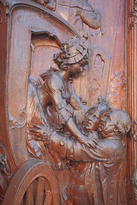 Wood carving on the entrance door to Heylshof, lady in baroque clothing getting off the carriage, noblewoman, wooden door, detail, handicraft, relief, Worms, Rhineland-Palatinate, Germany