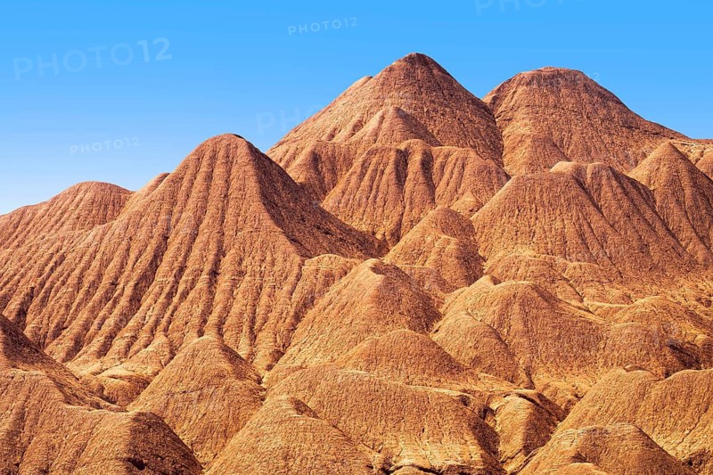 Eroded sedimentary formations create mesmerizing patterns in the Devil's Desert (Desierto del Diablo) located in Salta, Argentina, showcasing nature's rugged artistry