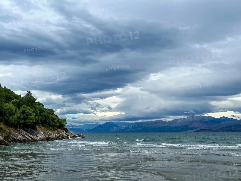 Kalamaki, Corfu, Greece, View from Kalamaki beach in the north-east of the Greek island of Corfu over the Ionian Sea towards the mainland of Albania near the town of Saranda