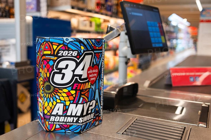 LUBIN, POLAND - JANUARY 15, 2026: A colorful 34th Grand Finale WOSP charity collection box stands on a checkout counter in a modern supermarket
