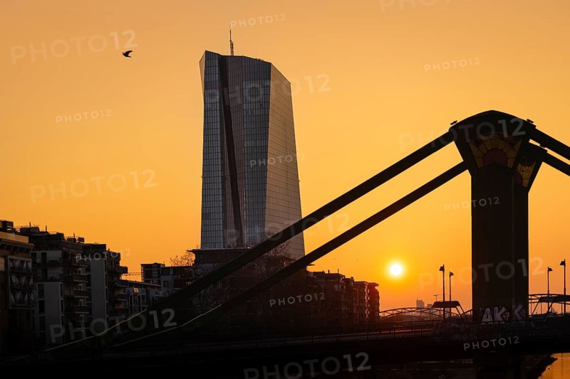 The sun rises behind the European Central Bank (ECB) in Frankfurt am Main, Frankfurt am Main, Hesse, Germany