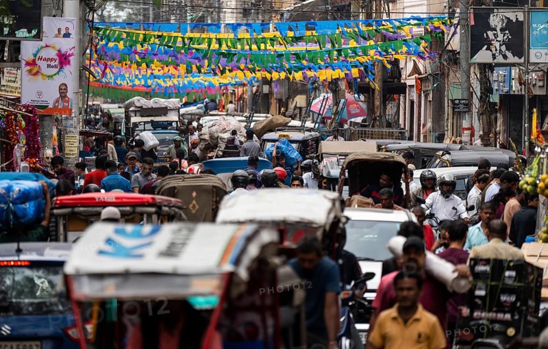 A crowded street in a market on the eve of Holi Festival, on March 13, 2025 in Guwahati, India. Holi is a Hindu festival celebrated mainly in India marking the arrival of spring it is also known as the Festival of colors, as people throw vibrant colored powders at each other, dance, and celebrate with music and sweets