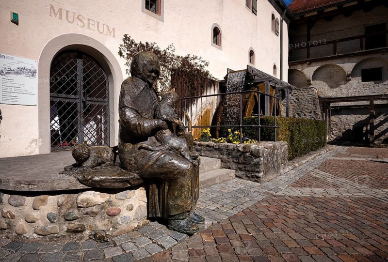 Maria Neff sculpture, water wheel, mnemonic in front of the municipal museum and cheese making museum, old town, Wangen im Allgäu, Bavaria, Germany