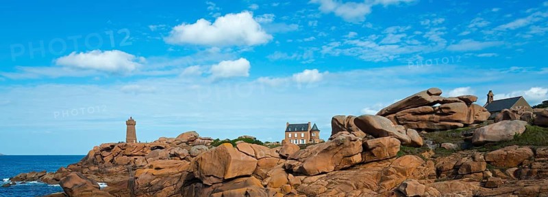 Wide coastal landscape with large rocks, blue sky and lighthouse, Phare de Men Ruz, Maison Gustave Eiffel and Chapelle du diable, Ploumanac'h, Ploumanach, Pointe de Squewel, Perros-Guirec, pink granite coast, Côte de Granit Rose, Brittany, France