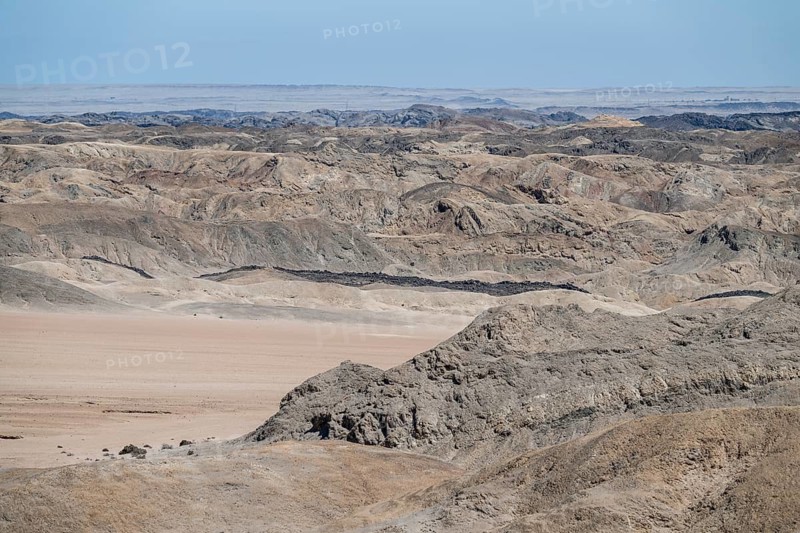 Rocky landscape furrowed by erosion, dry river bed of the Swakop River, Moon Valley, Namib-Naukluft Park, Namib Desert, Namibia