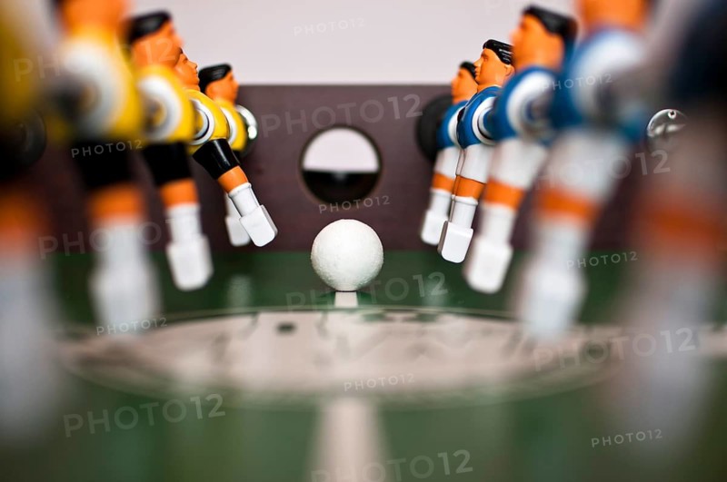 Football table players and balll close up