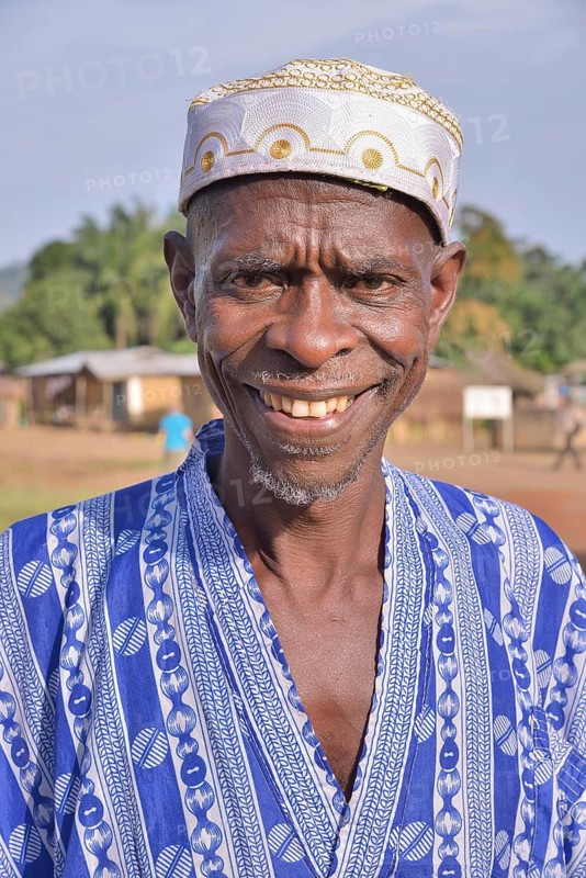 Portrait of a smiling man in Muslim dress, Muslim, Waiima, Kono District, Sierra Leone