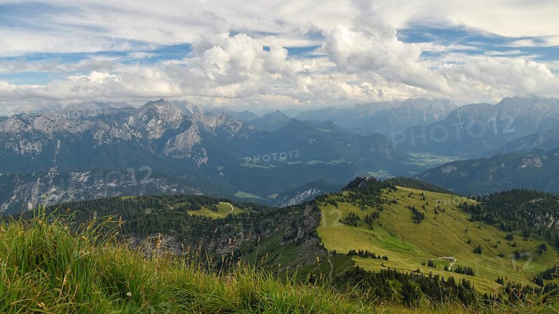 View from the summit of the Sonntagshorn, the highest mountain in the Chiemgau Alps, towards horse-rider Alm and Lofer, Salzburger Land, Austria