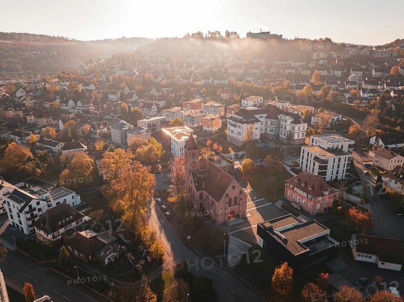 Bird's eye view of the church and surrounding houses in autumnal surroundings, Nagold, Black Forest, Germany