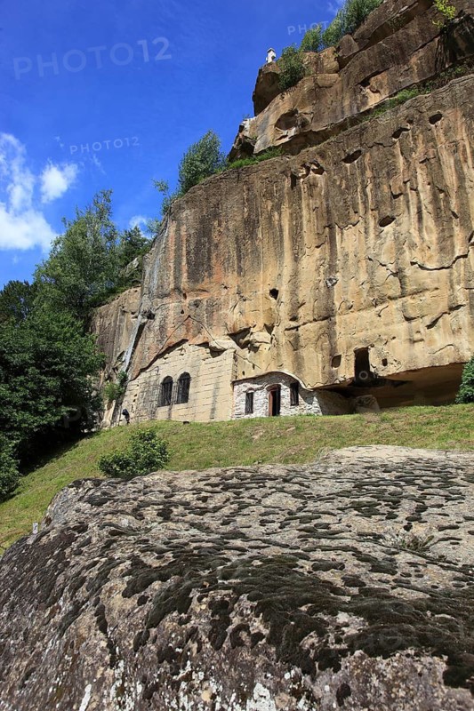 Corbii de Piatra rock monastery, stone ravens carved into a massive, 30-meter high sandstone wall, village of Jgheaburi, municipality of Corbi, in the district of Argesin, Wallachia, Romania