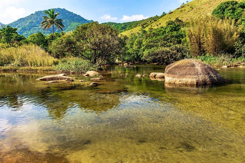 River that flows into Bonete beach on the island of Ilhabela on the coast of Sao Paulo, Ilhabela, Sao Paulo, Brazil