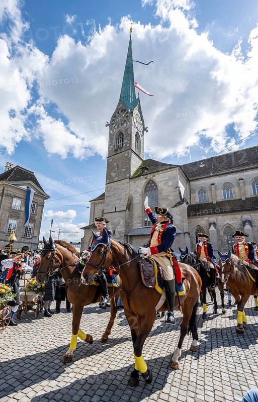 Historically costumed guild members in Zurich's old town, riders in front of the Fraumünster church, Zunft zur Meisen, Sechseläuten or Sächsilüüte, Zurich Spring Festival, Zurich, Switzerland