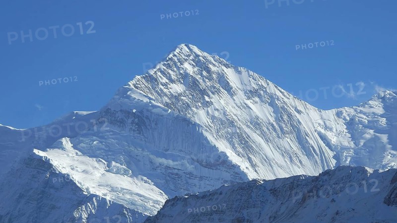 Majestic snow-capped summit of Gangapurna under a bright blue sky, trekking at Annapurna Circuit, Nepal, trekking at Annapurna Circuit, Manang, Nepal