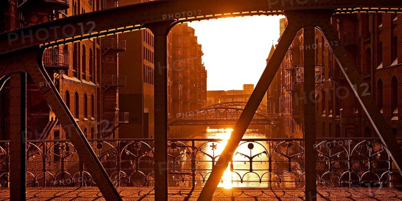 View from the Kannengießerort Bridge backlit into the Wandrahmsfleet, Speicherstadt, Hamburg, Germany