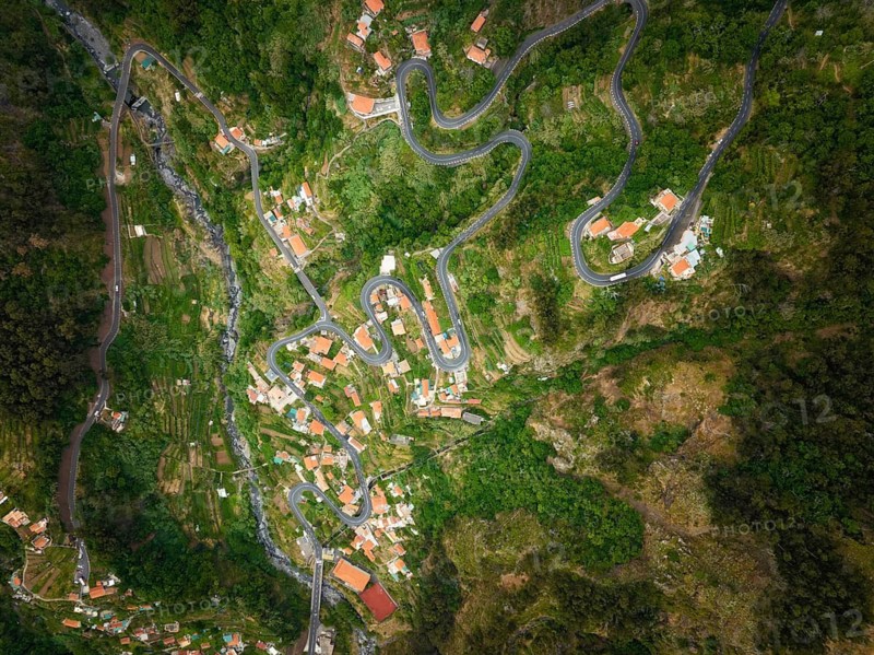 Aerial drone top down view of Curral das Freiras village in Valley of the Nuns from Miradouro da Eira do Serrado, Madeira island, Portugal