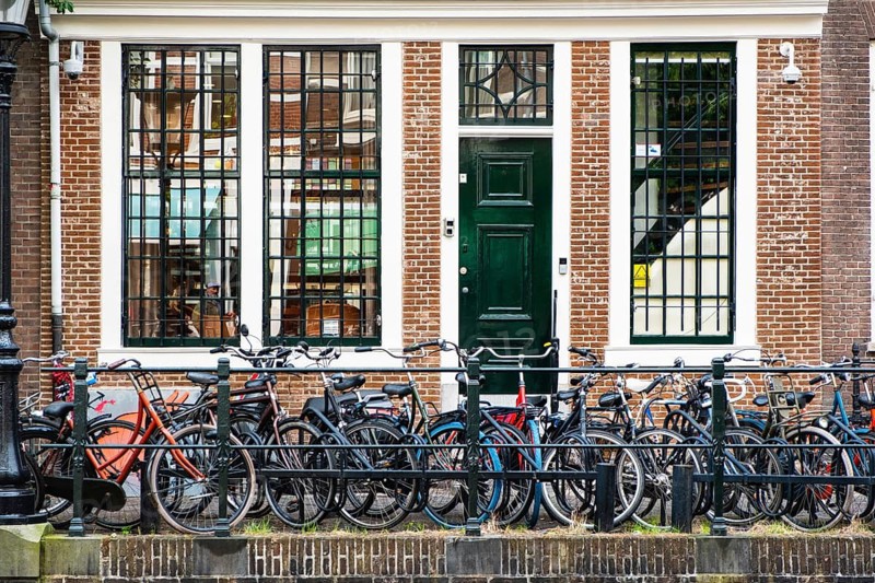 Bicycles parked on a canal in the city centre of Utrecht, Netherlands
