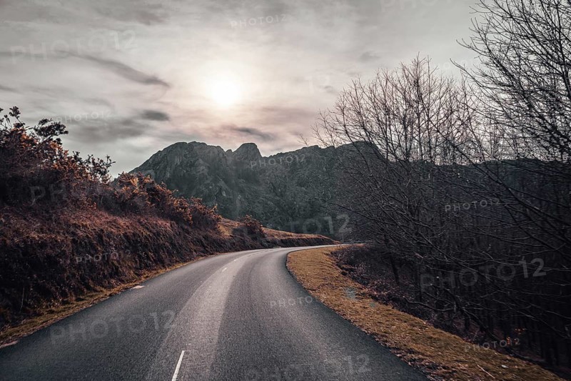 Road at sunrise in the mountain of Aiako Harria or Peñas de Aya, Guipúzcoa. Basque Country