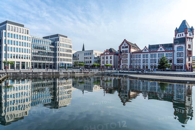 The Hörder Castle and modern office buildings on Lake Phoenix in Dortmund, North Rhine-Westphalia, Germany
