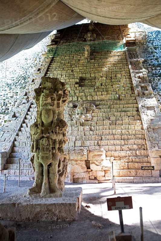 Stone sculpture and hieroglyphic staircase at Copán Archaeological Site, Mayan Ruined City in the Rainforest or Jungle, Copán Department, Honduras