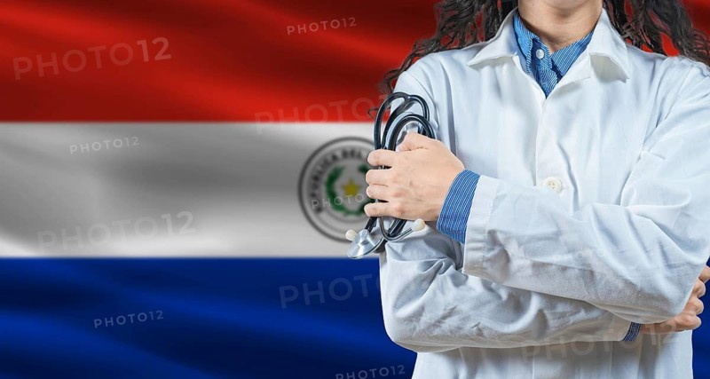 Healthcare professional with Paraguay flag background. Professional doctor holding stethoscope on Paraguay flag background