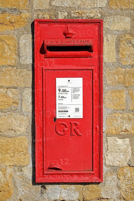 Old red letterbox in a wall, Snowshill, The Cotswolds, England, Great Britain