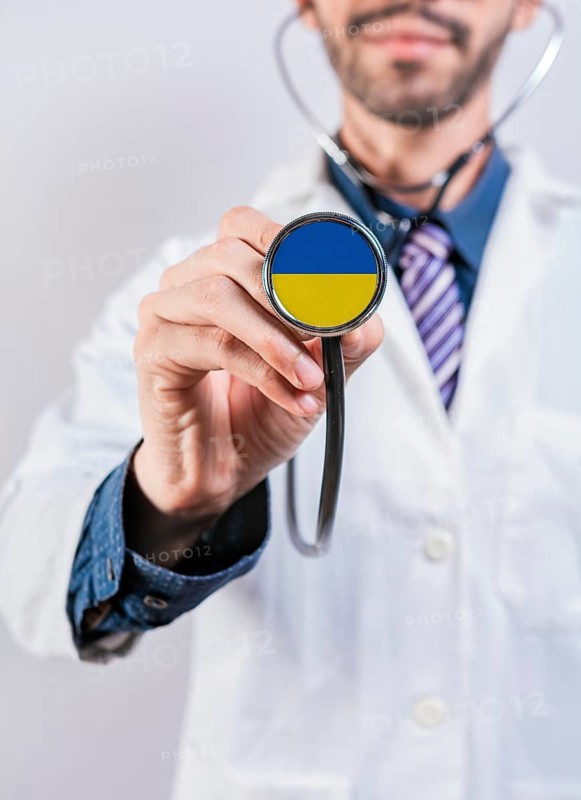 Ukraine health and medical insurance concept. Ukraine Healthcare System, doctor holding stethoscope