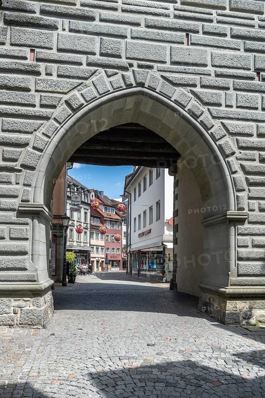 View through the Schnetztor, historic city gate to the pedestrian zone in the old town of Constance, with medieval ensemble of houses, district of Constance, Baden-Württemberg, Germany