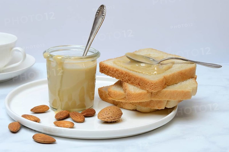 Almond cream in a jar and toast