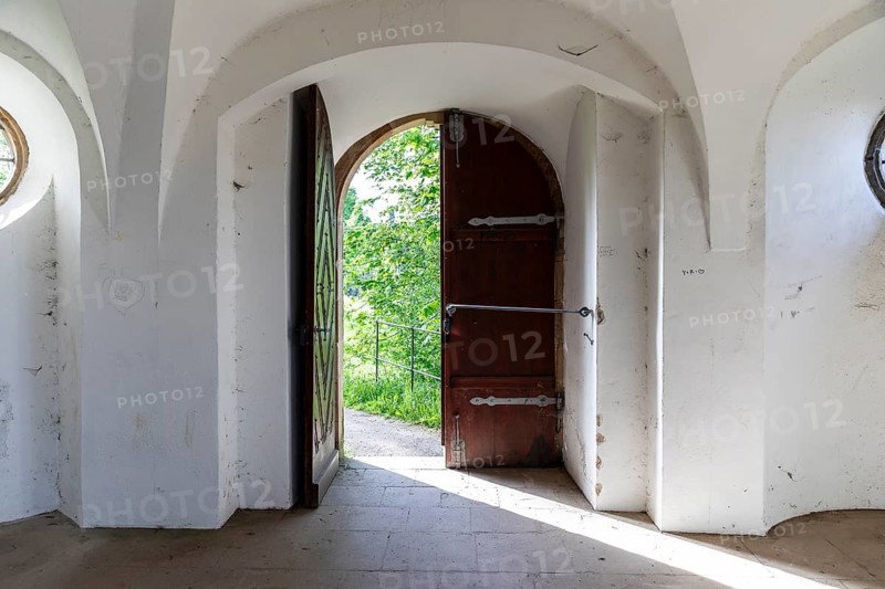 View through an open door into the greenery, Pavilion at Michaelisberg, Bamberg, Bavaria, Germany
