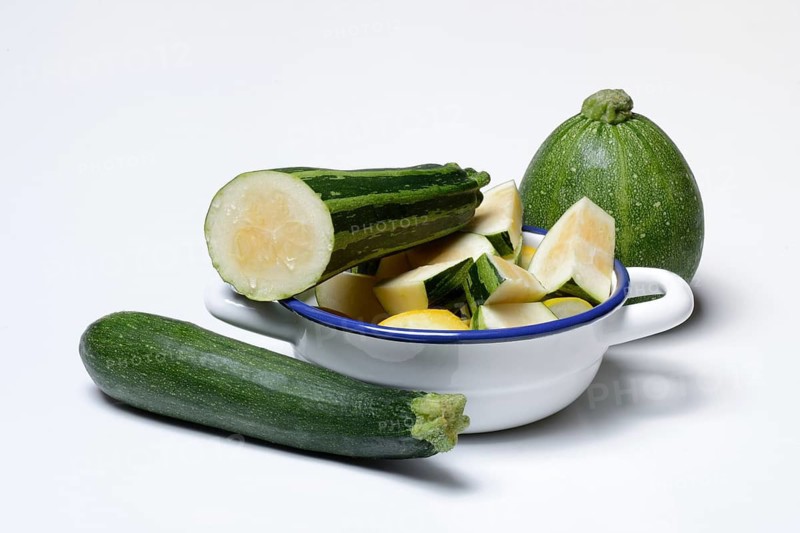 Various courgettes (Cucurbita pepo), courgettes cut up in pot convar. giromontiina