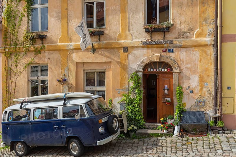 One van Volkswagen Bulli T2 standing in front of the Lazy River Hostel in Loket, Czech Republic