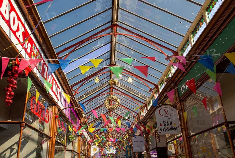Decorations and bunting flags in Victoria Arcade c 1920s, Great Yarmouth, Norfolk, England, UK