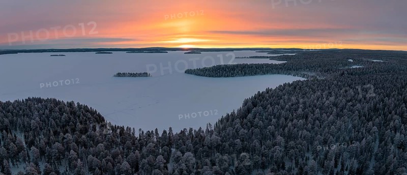 Frozen lake with island, winter landscape, Posio, Lapland, Finland