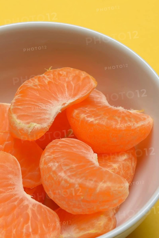 Clementine pieces in peel, citrus fruit