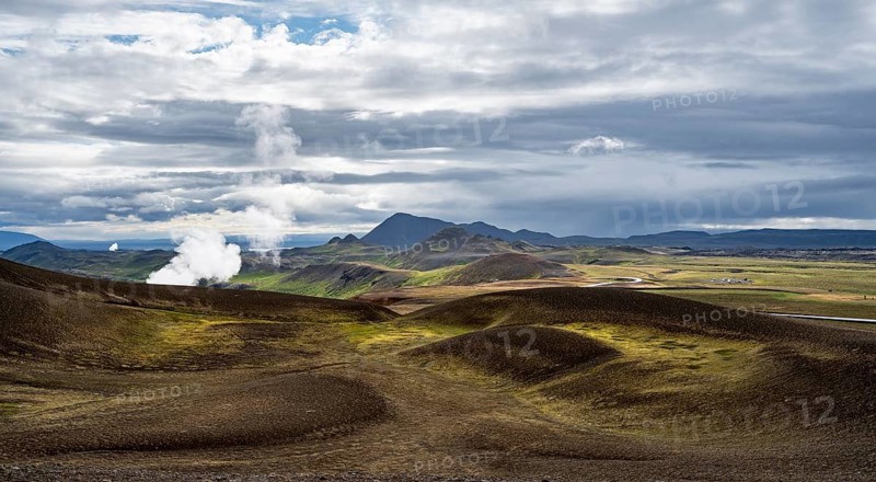Volcanic landscape with colourful hills, steam of the Krafla geothermal power plant, geothermal area, Northern Iceland, Iceland