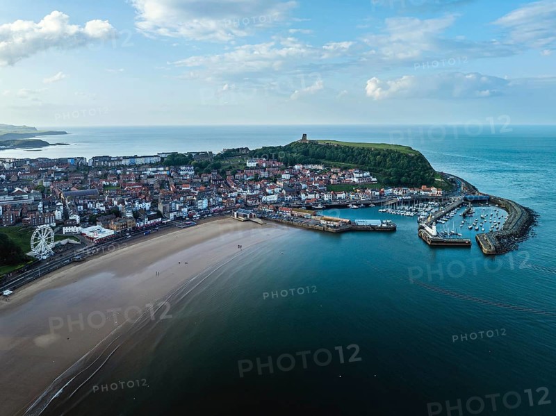 Scarborough Lighthouse and Harbour from a drone, Vincent Pier, Scarborough, North Yorkshire, England, United Kingdom