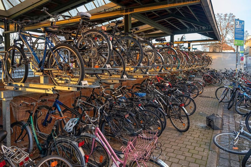 Bicycle car park at the railway station in the evening light, Erlangen, Middle Franconia, Bavaria, Germany