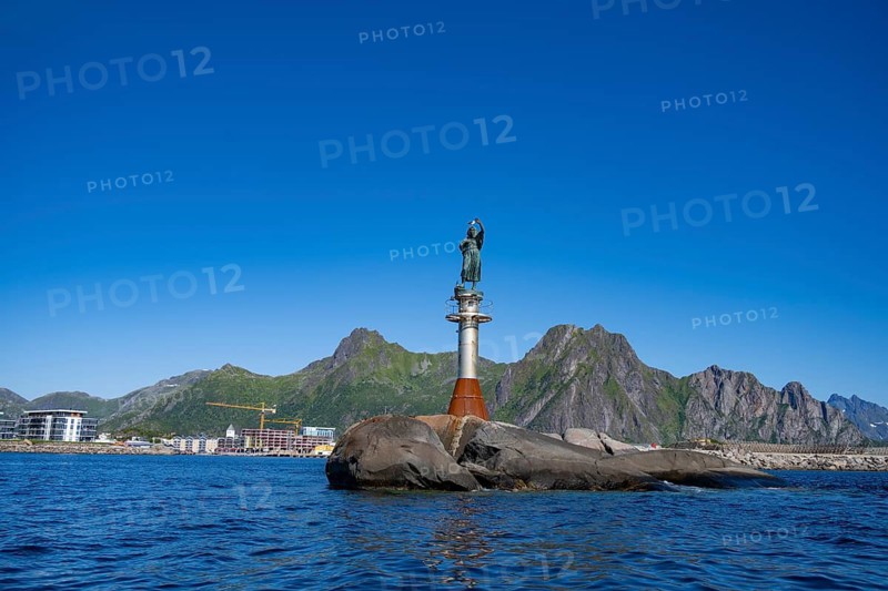 Figure Fiskerkona at the harbour of Svolvaer, mountains and sea, Lofoten, Nordland, Norway