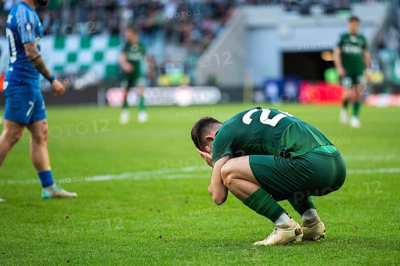 Footballer after missing shoot during soccer match