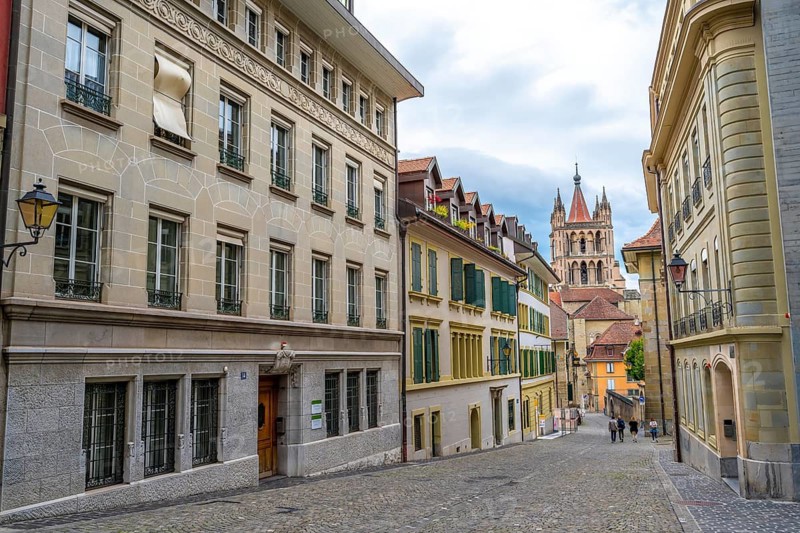 Alley in the Cité and tower of Notre Dame de Lausanne Cathedral, historic old town, Lausanne, Vaud, Switzerland