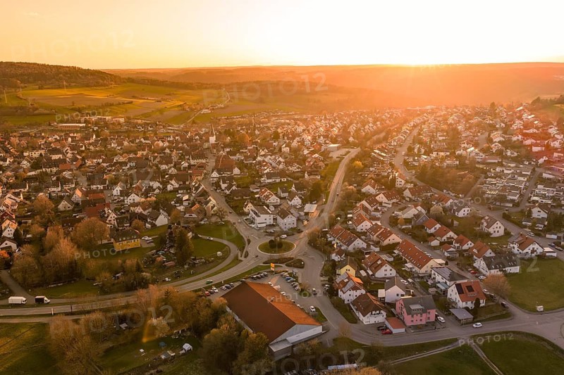 Village view at sunset with intense orange tones and cozy village character, Calw, Stammheim, Calw district, Germany