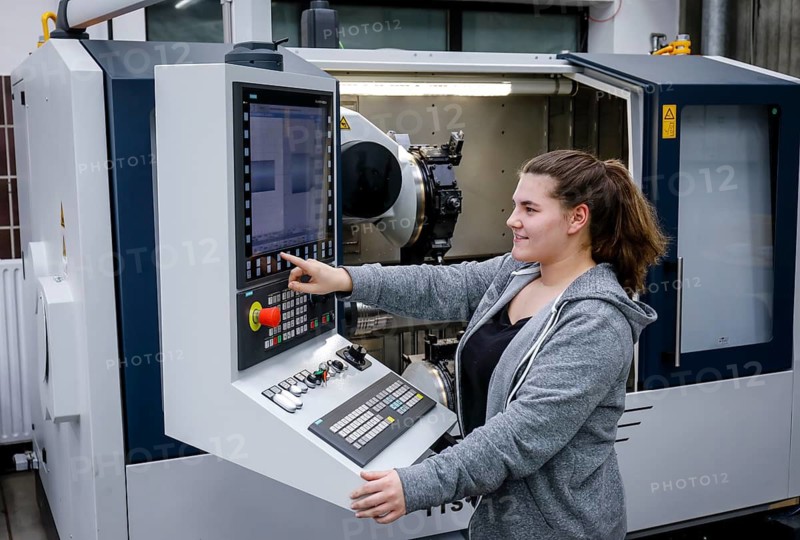 Remscheid, North Rhine-Westphalia, Germany - Trainee woman in metalworking, here at a CNC machine tool, Vocational Training Centre of the Remscheid metal and electrical industry. - FOR EDITORIAL USE ONLY!