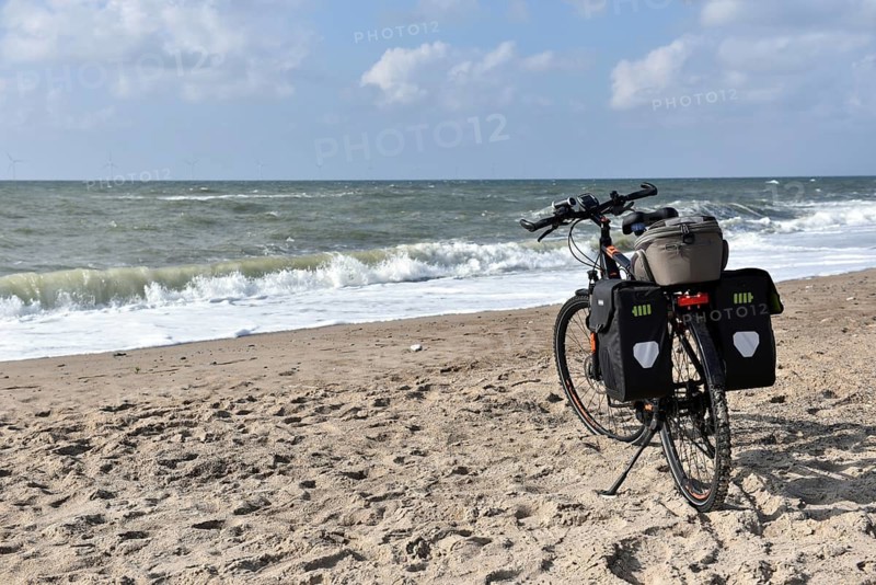 Bicycle, e-bike on the Danish North Sea, breakwater, Denmark