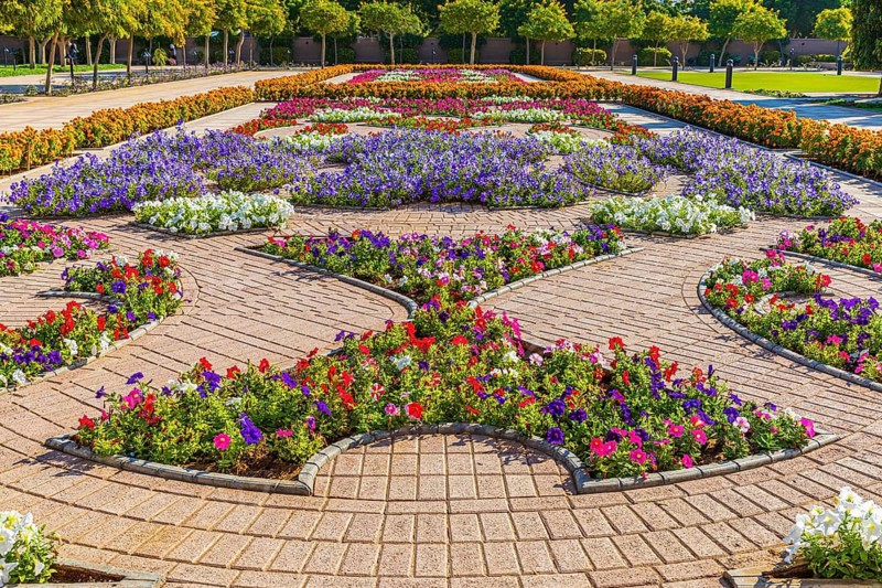 Park decorated with flowers in front of the Sultan Qaboos Mosque, Muscat, Arabian Peninsula, Sultanate of Oman