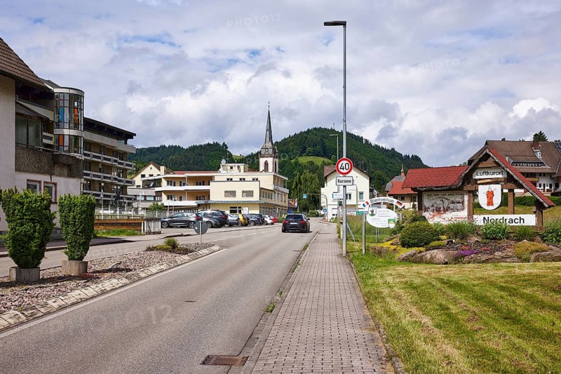 Entrance to town, tourist information sign, climatic health resort, lantern, 40 km/h speed limit sign, additional sign for spa zone, St. Ulrich church, general architecture, Im Dorf road, Nordrach, Black Forest, Ortenau district, Baden-Württemberg, Germany