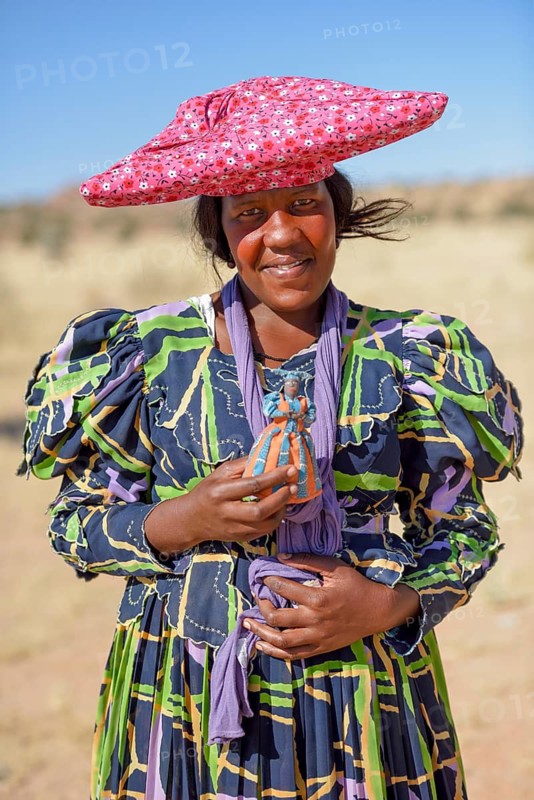 Herero woman in traditional costume, near Khorixas, Kunene Region, Namibia