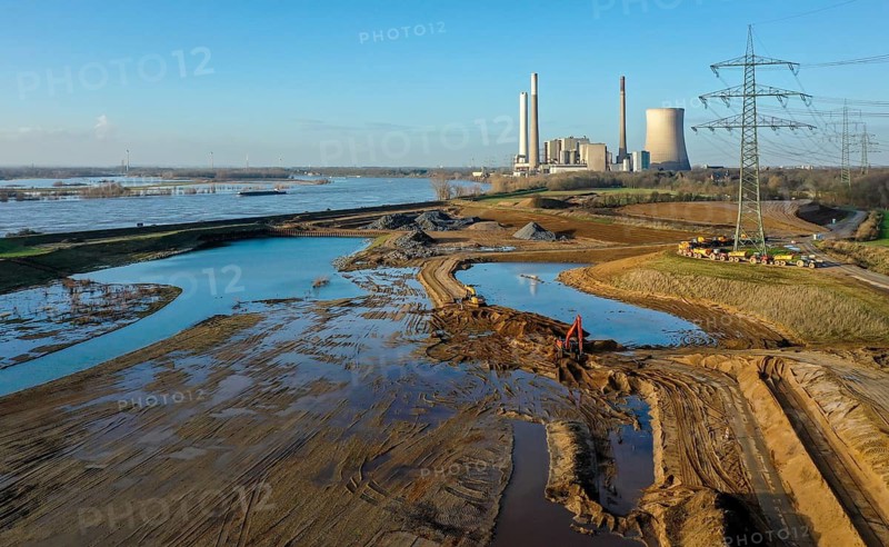 Dinslaken, North Rhine-Westphalia, Germany, New Emscher estuary into the Rhine. Construction site of the new Emscher estuary in front of the decommissioned STEAG coal-fired power station in Voerde. The mouth of the Emscher into the Rhine is being moved almost 500 metres north from Dinslaken to Voerde. Fish will then be able to swim barrier-free up the new Emscher from the Rhine through a newly created floodplain area. Following the construction of a parallel sewer, the Emscher has been completely free of sewage since January 2022. The river was previously an open, above-ground combined sewer with rainwater and wastewater
