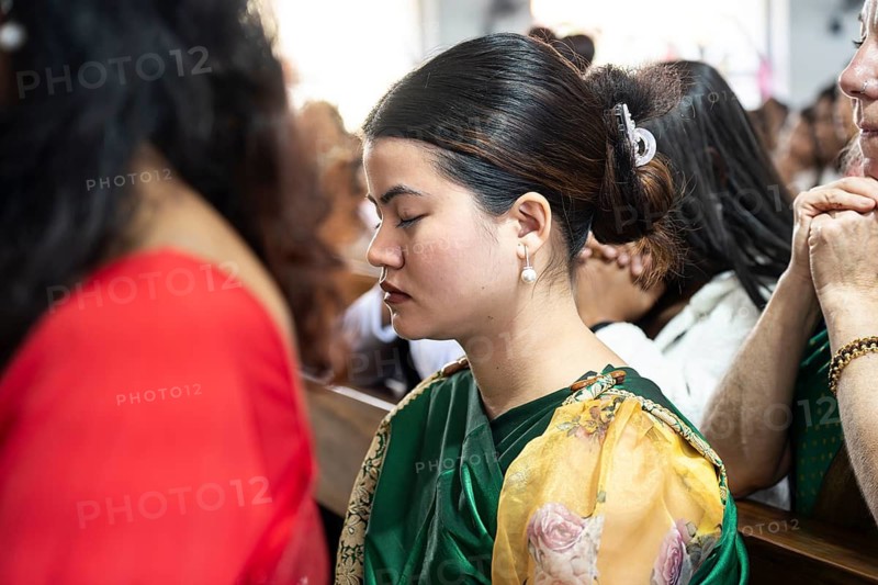 Devotees pray in church during a Christmas day sermon on December 25, 2024 in Guwahati, India. Christmas is a festive holiday celebrated on December 25th, marking the birth of Jesus Christ in Christian tradition.